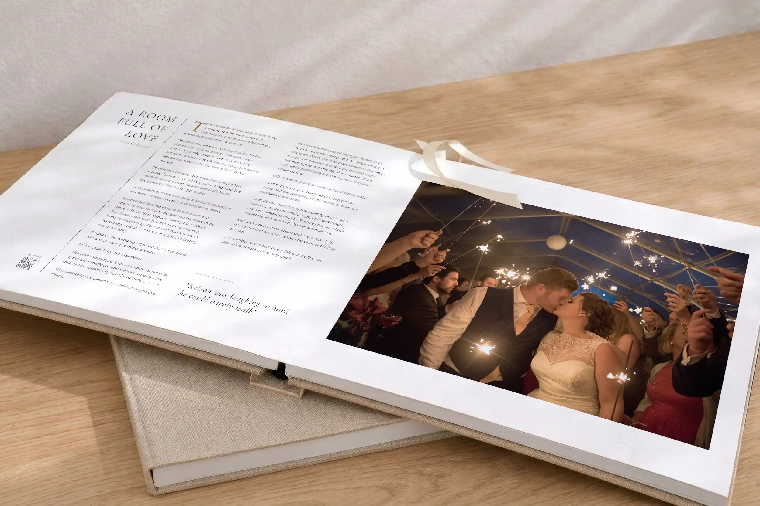An open Love Retold book with voice recording QR codes alongside wedding photography
